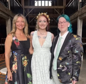 Indianapolis Wedding Officiant Bretta with two women one with colorful hair in a suite and one in a white dress