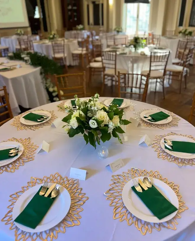 Wedding by Bretta Blog IMG 4 Reception tables with white florals and green napkins