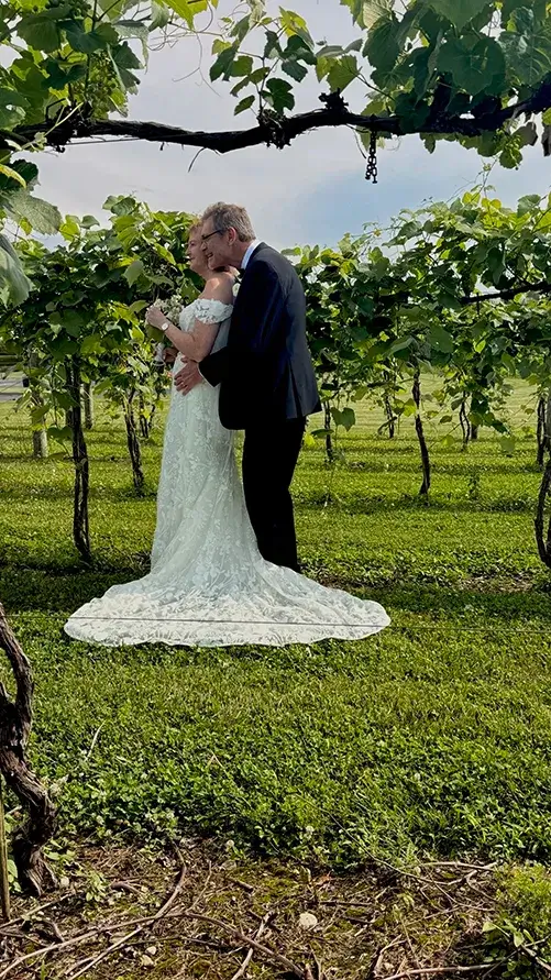 Greg and Shelly Vineyard Portrait at The Sycamore at Mallow Run Newlyweds Greg and Shelly sharing a romantic moment among the vineyard rows at The Sycamore at Mallow Run wedding venue
