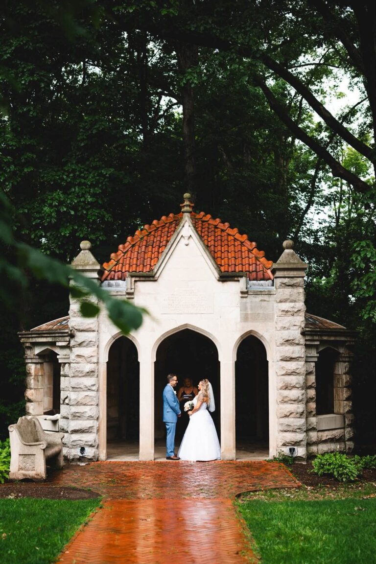 Wedding officiant leading a ceremony at the Rose Well House in Bloomington, Indiana