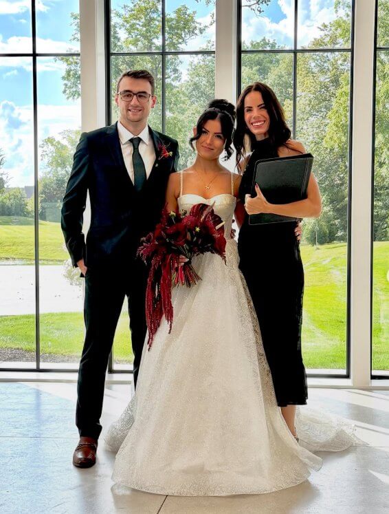 Officiant Bretta Thompson with a bride and groom in the Vowery at Westwood