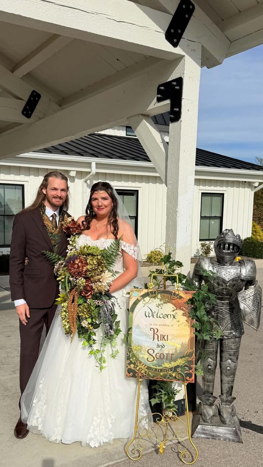 Bride and groom with their welcome sign at The Sixpence in Whitestown, Indiana