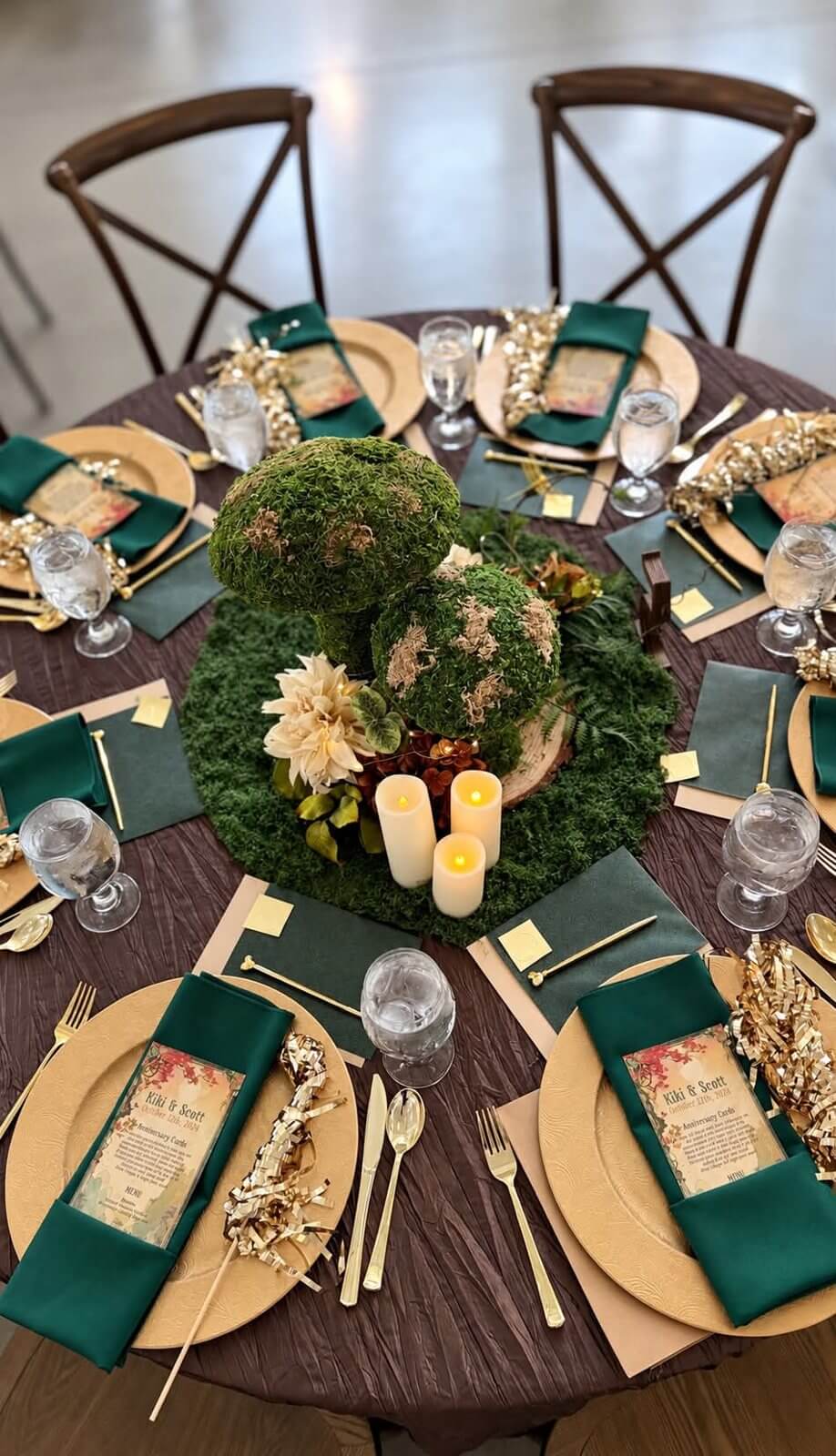 Reception table setting with moss centerpiece at The Sixpence wedding venue