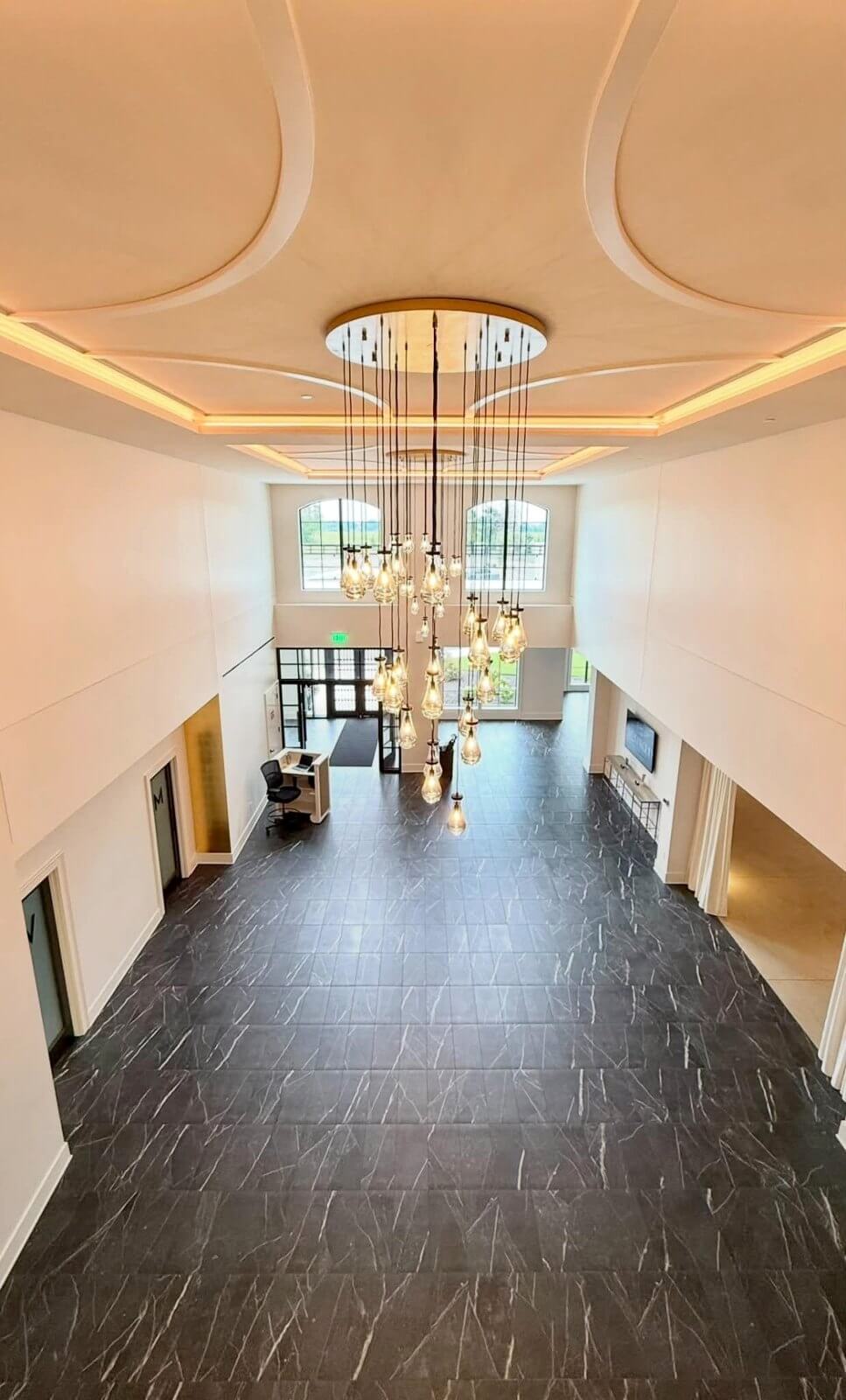 Grand lobby with a pendant chandelier at Westwood Vowery and Estate